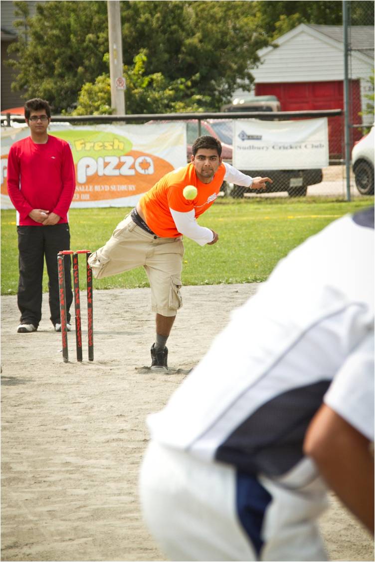 Cricketer bowling